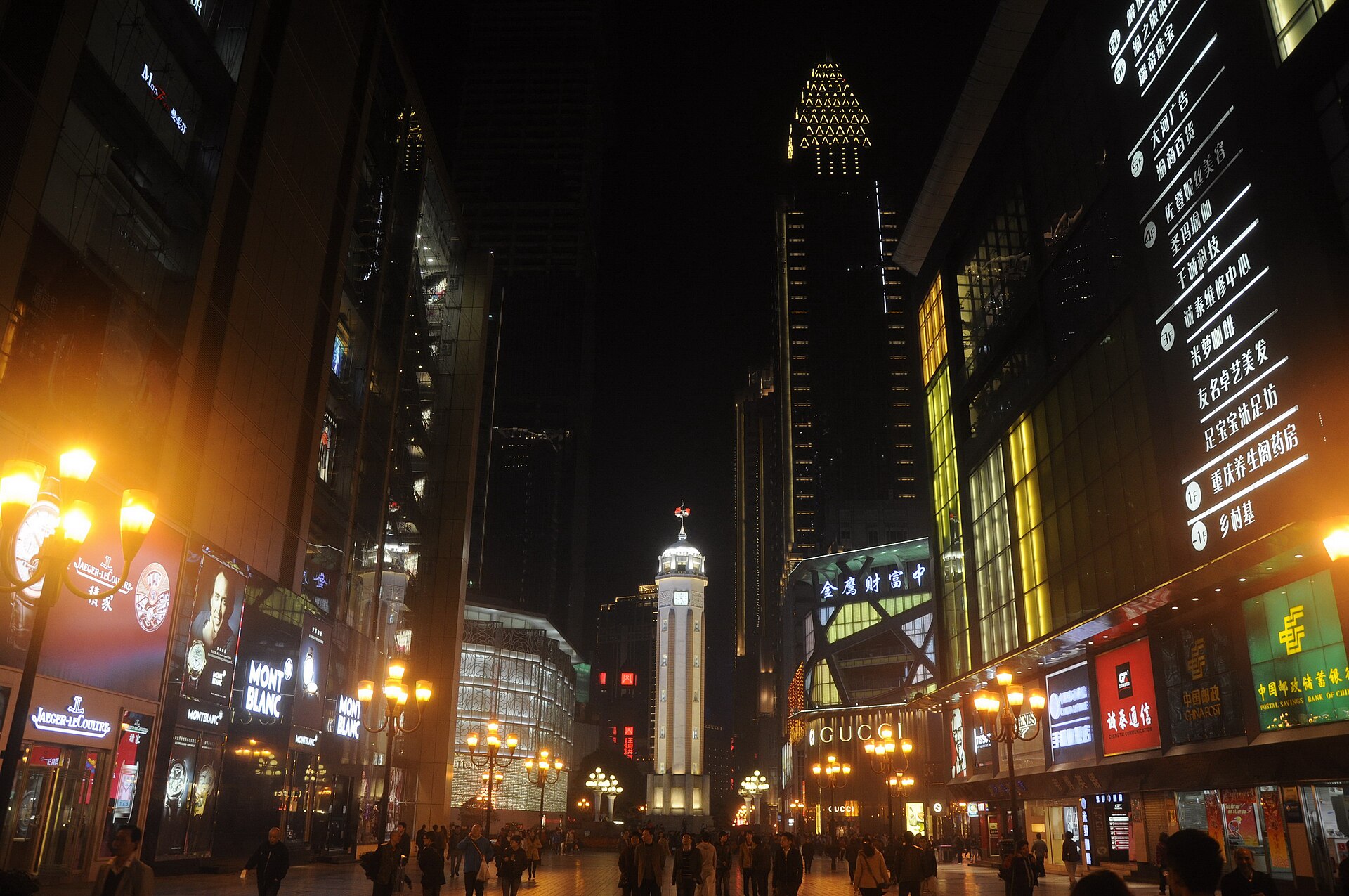 Chongqing's two-river skyline at blue hour — towers stacked up the mountainside, the Yangtze and Jialing glowing below