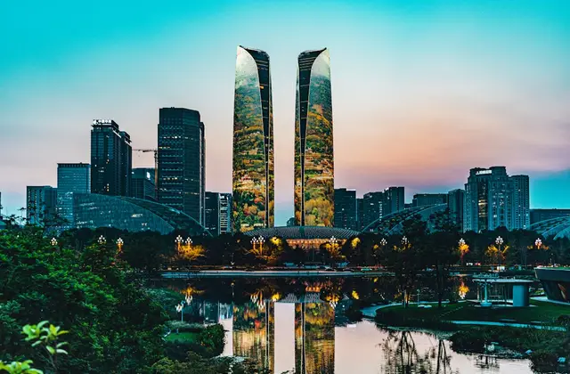 Chengdu skyline at dusk behind a panda-dotted park — or a steaming hotpot table, hero shot