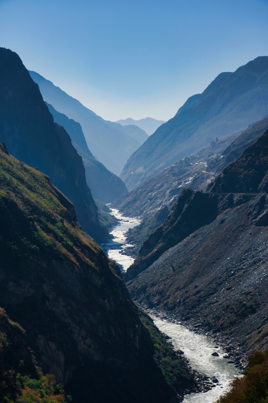 The Jinsha River thundering through Tiger Leaping Gorge below the cliffs of Jade Dragon and Haba snow mountains
