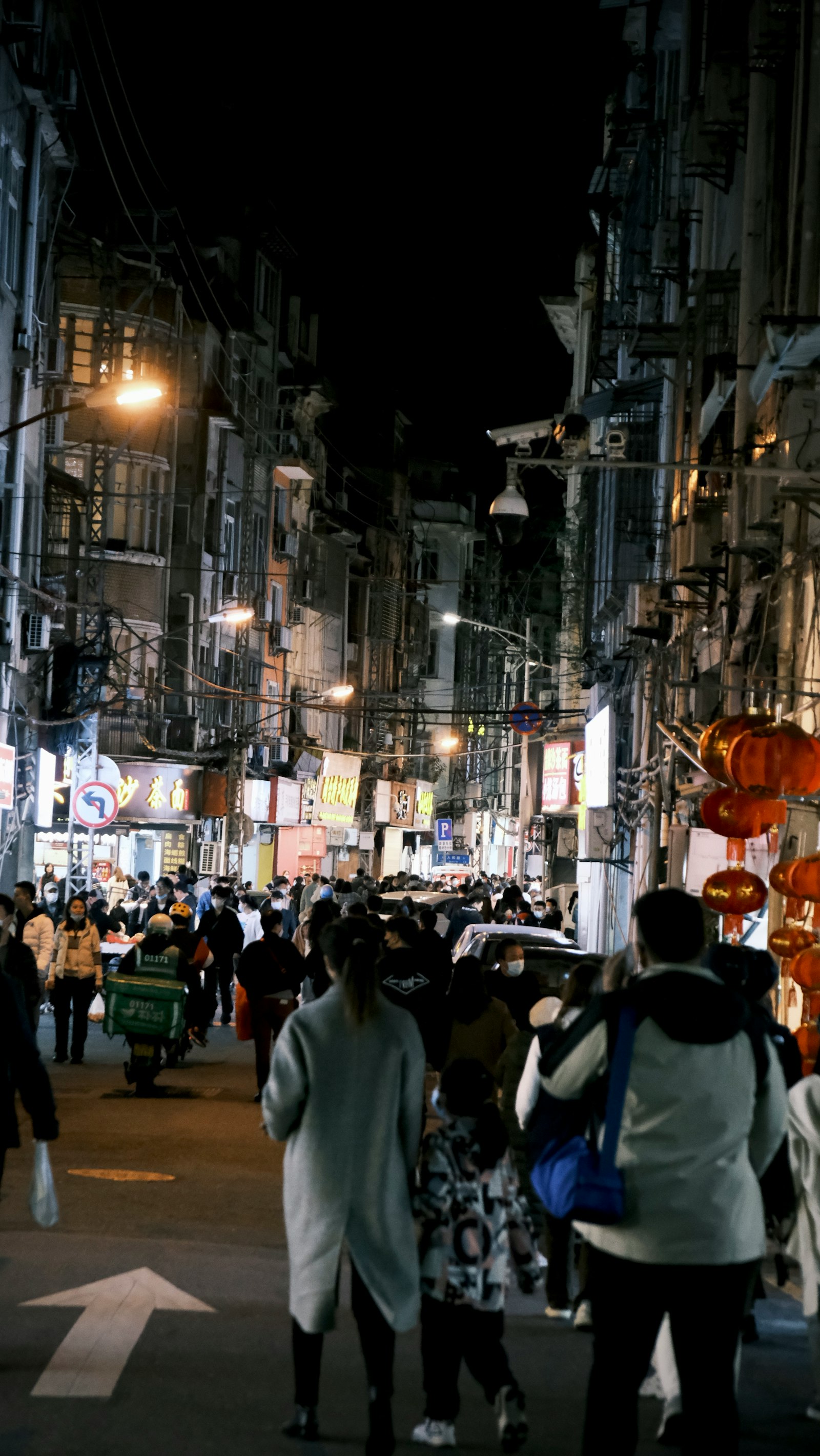 Shapowei's old harbour at night — moored fishing boats, neon bar signs, craft-beer crowds